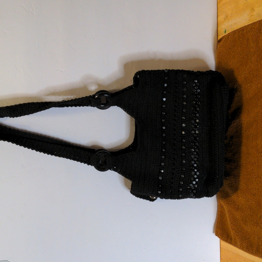 Small black macrame purse.